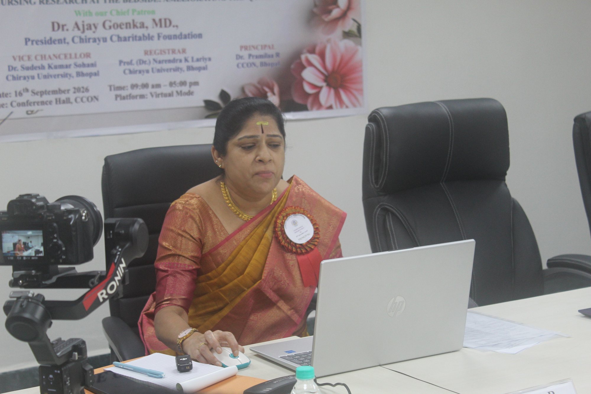 Speaker addressing the meet from the conference hall